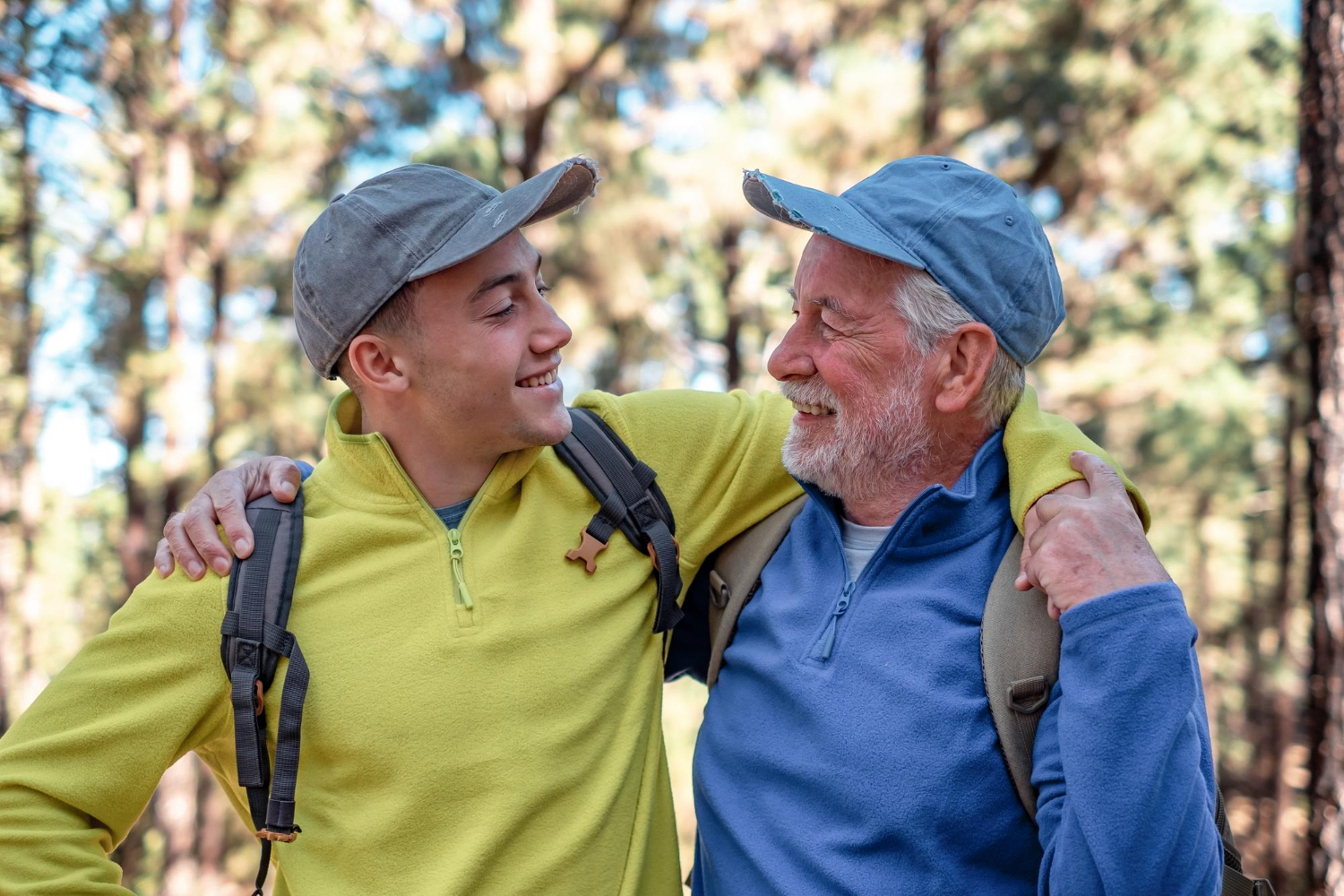 Two generations enjoying a walk together on a forest trail